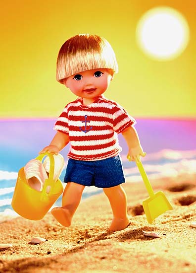 product photography of boy doll strolling the beach