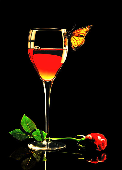 product photography of wine glass, butterfly and rose