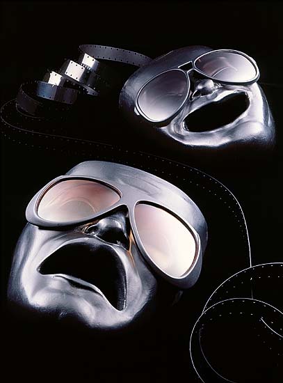 product photography of comedy and tragedy masks with sunglasses