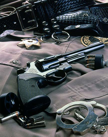 editorial photography of sheriff's gun and badge